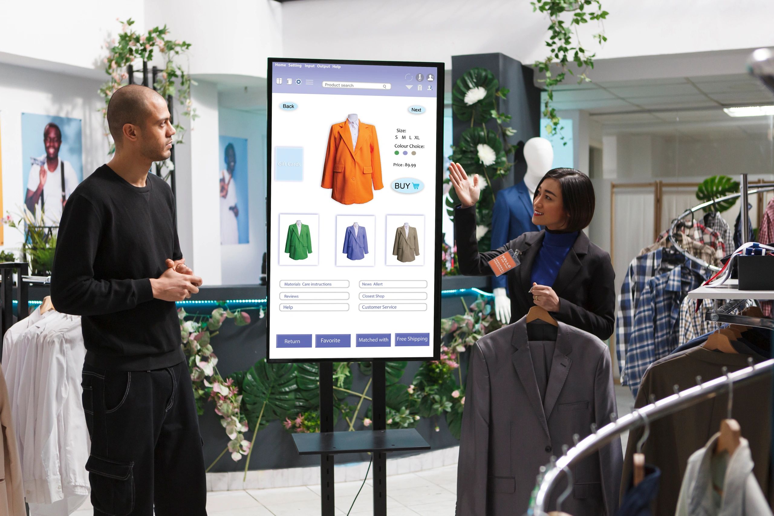Asian store assistant showcasing items to man in